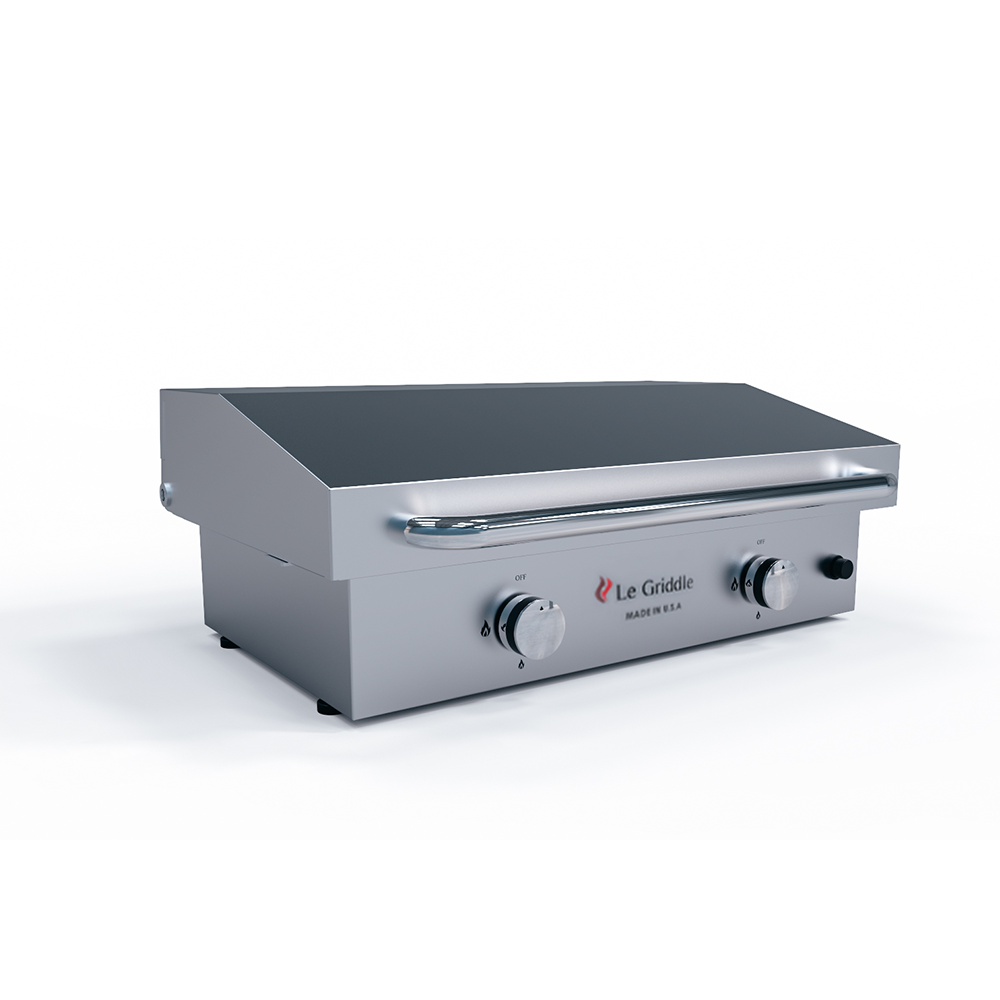 Stainless steel griddle with control knobs on a white background
