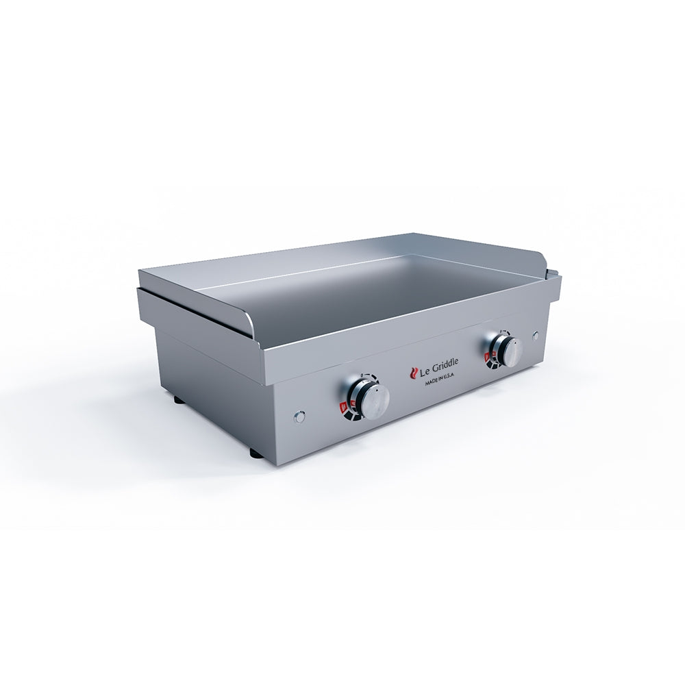 Stainless steel griddle with control knobs on a white background
