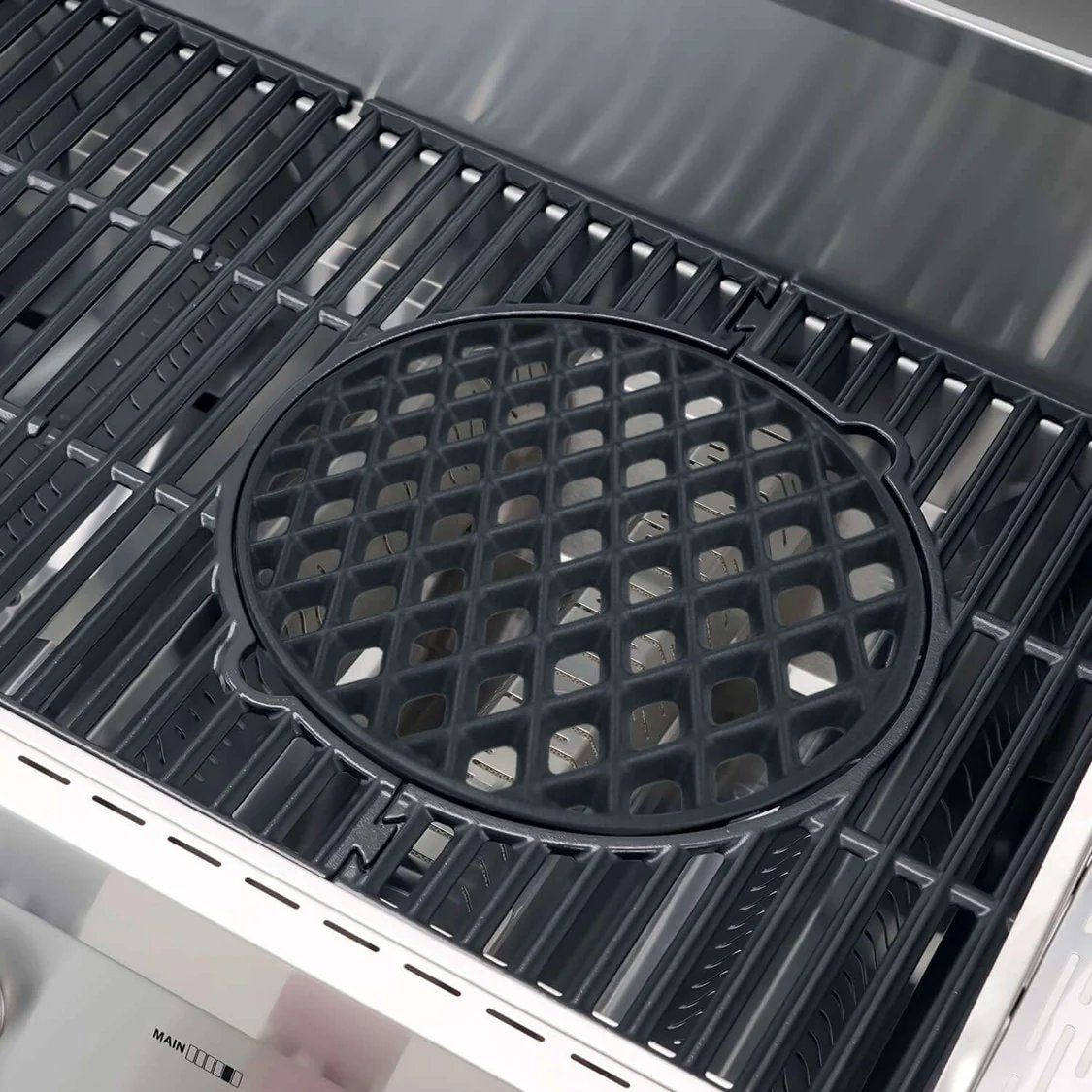 Black cast iron griddle on a Monument Grills Denali 605 Pro