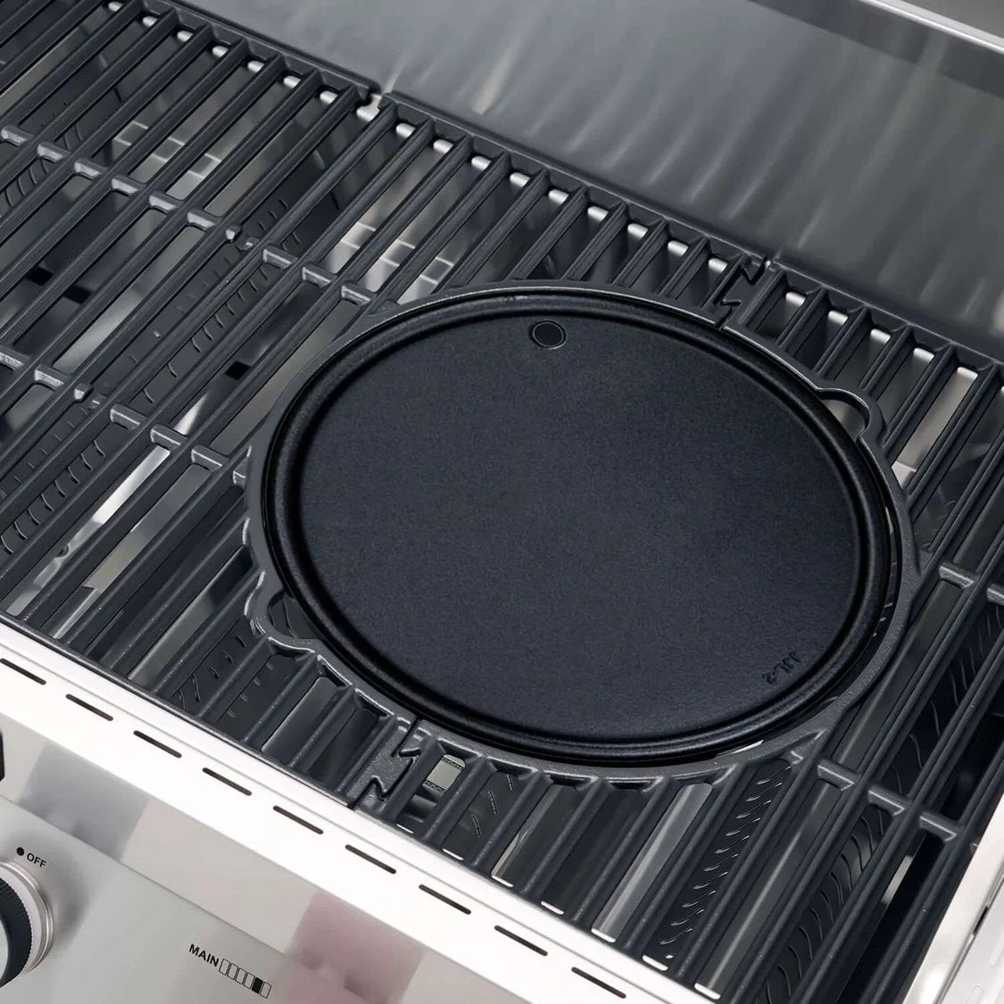 Black griddle on a Monument Grills Denali 605 Pro