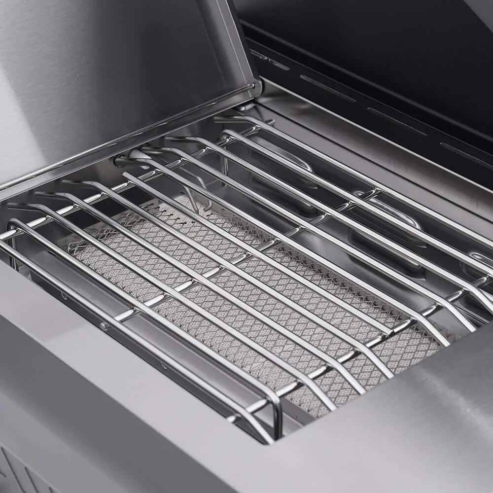 Monument Grills Eminence 405 - Close-up of a grill with a metal grate inside an oven.