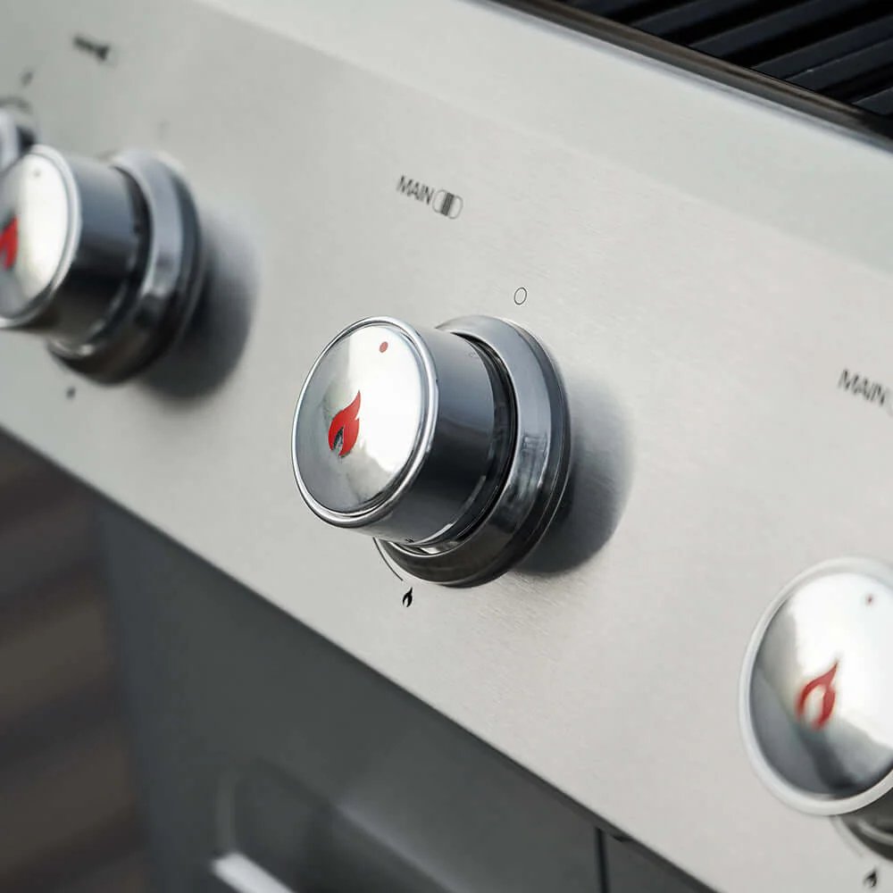 Close-up of Monument Grills Mesa 305 control knobs with brand logo