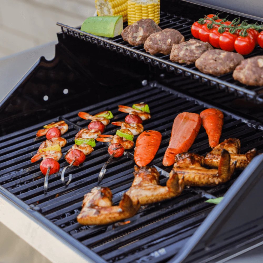 skewers of vegetables and meat cooking on a Monument Grills Mesa 305