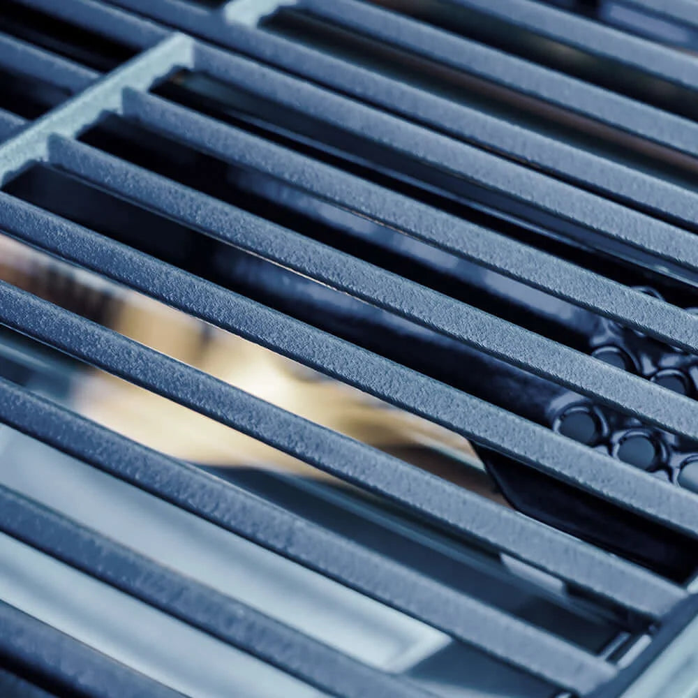 Close-up of a metal Monument Grills Mesa 305 grate