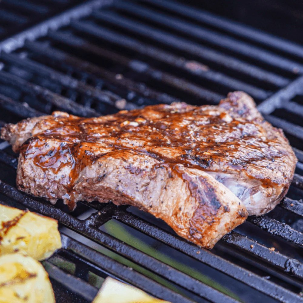 Grilled steak and vegetables on a Monument Grills Mesa 305.