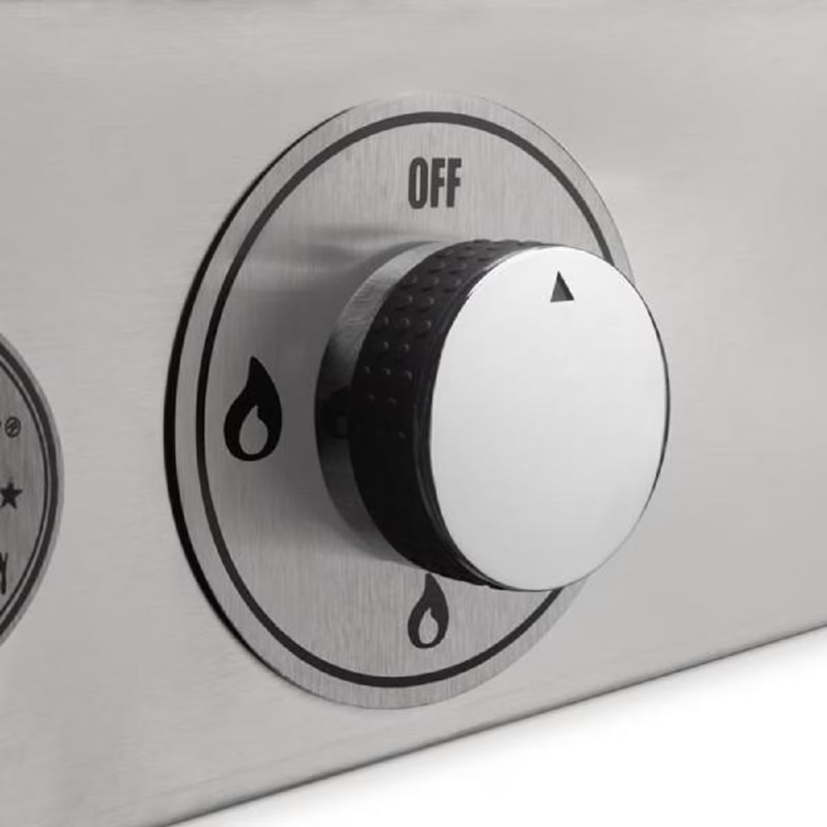 Stainless steel gas control knob with 'OFF' label on a stove
