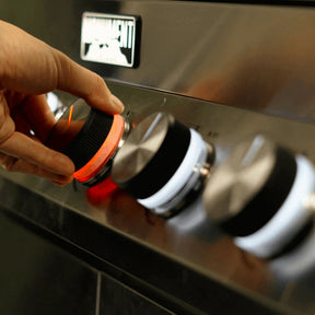 Monument Grills Denali 405 - Hand adjusting a knob on