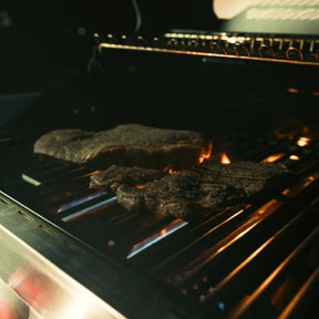 Meat cooking on a Monument Grills Denali 605 