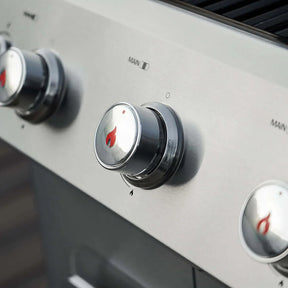Close-up of Monument Grills Mesa 305 control knobs with brand logo