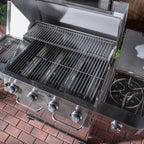 Stainless steel grill with multiple burners on a brick patio