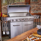 Stainless steel grill on a patio with outdoor cooking setup