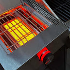 Close-up of a glowing grill with hot coals inside