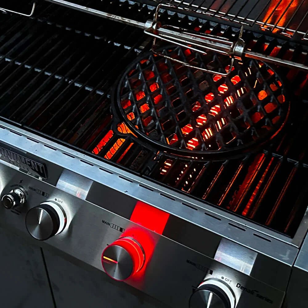 Close-up of a gas grill with glowing hot plates