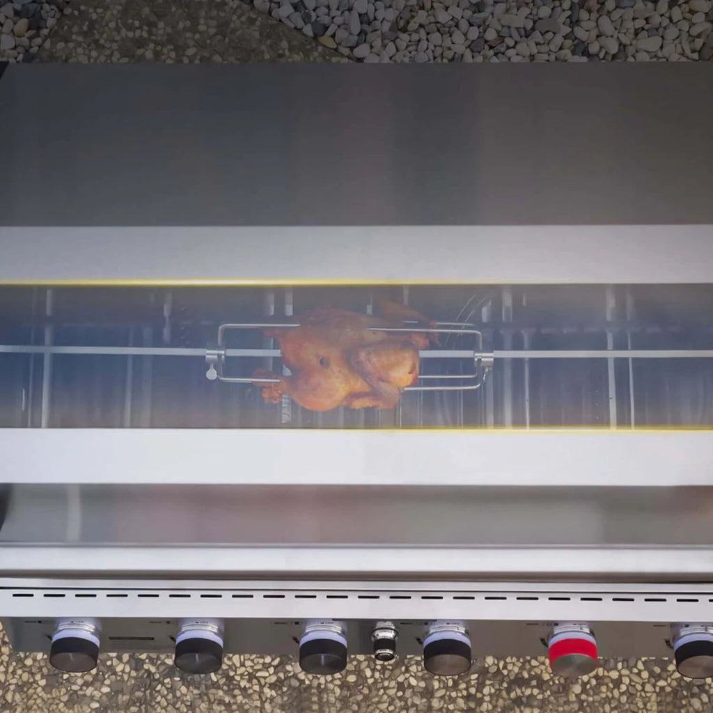 Chicken being cooked on a grill with a transparent lid