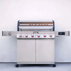 Stainless steel barbecue grill with digital display on a white background