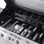 Monument Grills barbecue grill with open lid showing grates and branding.
