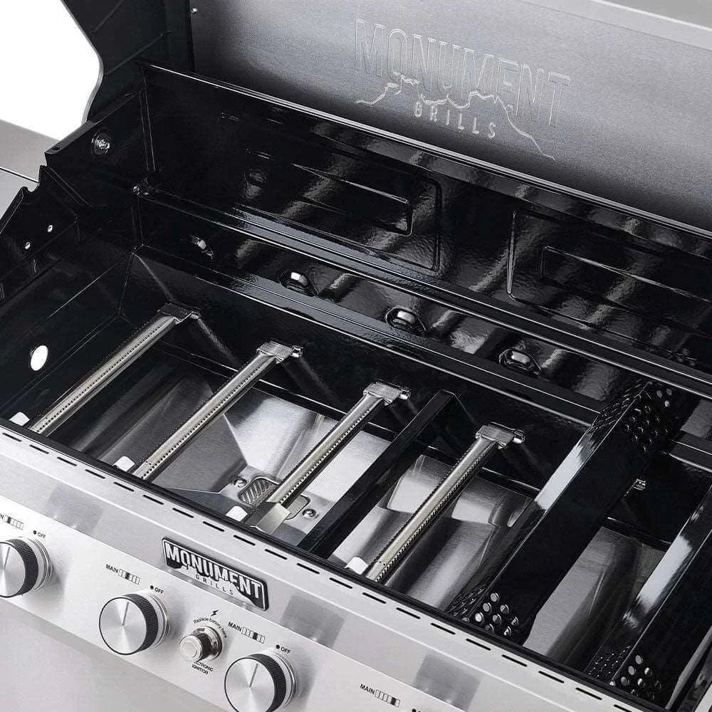 Monument Grills barbecue grill with open lid showing grates and branding.