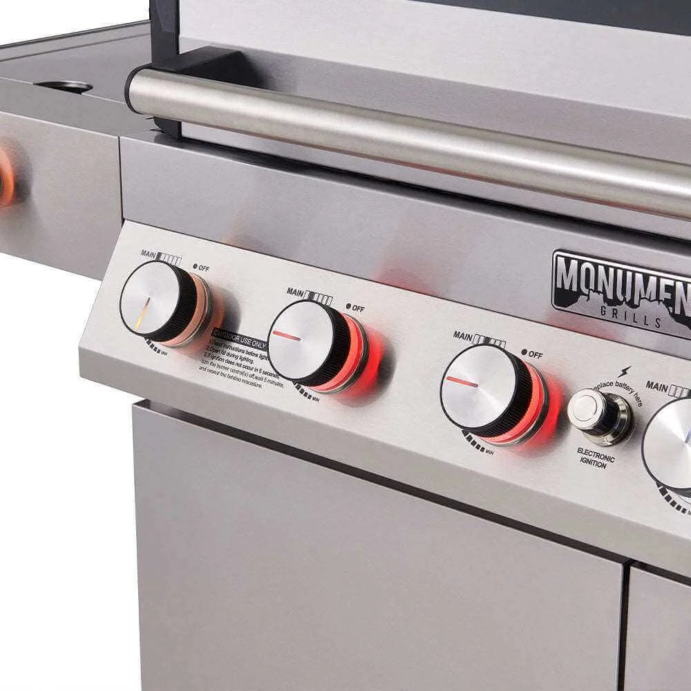 Close-up of a grill control panel with visible brand name 'Monument Grills'.