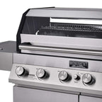 Close-up of a stainless steel grill with control knobs and 'Monument Grills' branding.