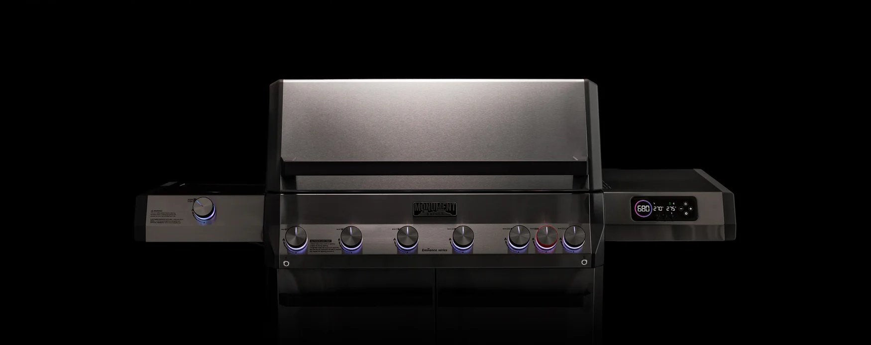 Black and silver grill with visible brand logo on a black background