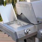 Outdoor grill with open lid on a patio