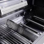 Close-up of a modern gas grill with multiple burners and grates.