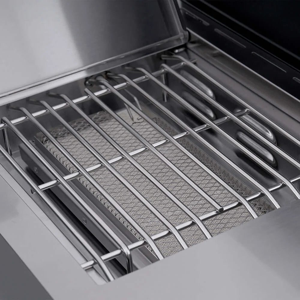 Close-up of a grill with a metal grate inside an oven.