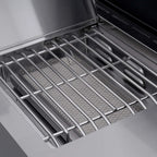 Close-up of a grill with a metal grate inside an oven.