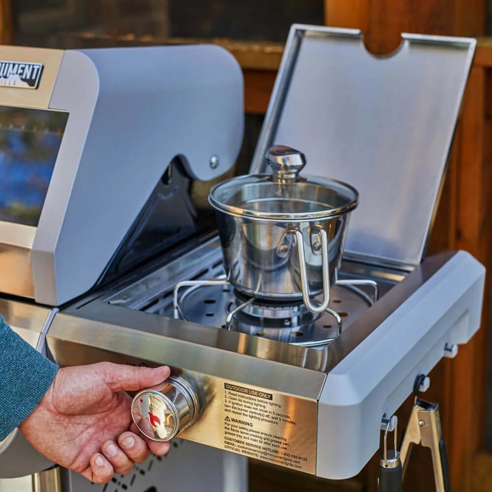 Portable stove with a coffee brewing apparatus on a wooden surface