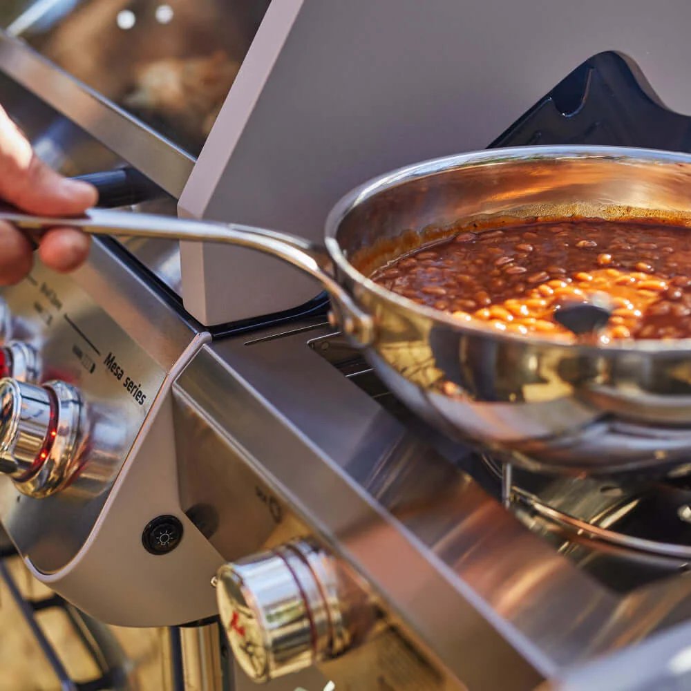 Stirring beans in a pot on a stove
