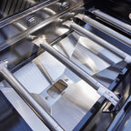 Close-up of a stainless steel grill with visible brand logo.
