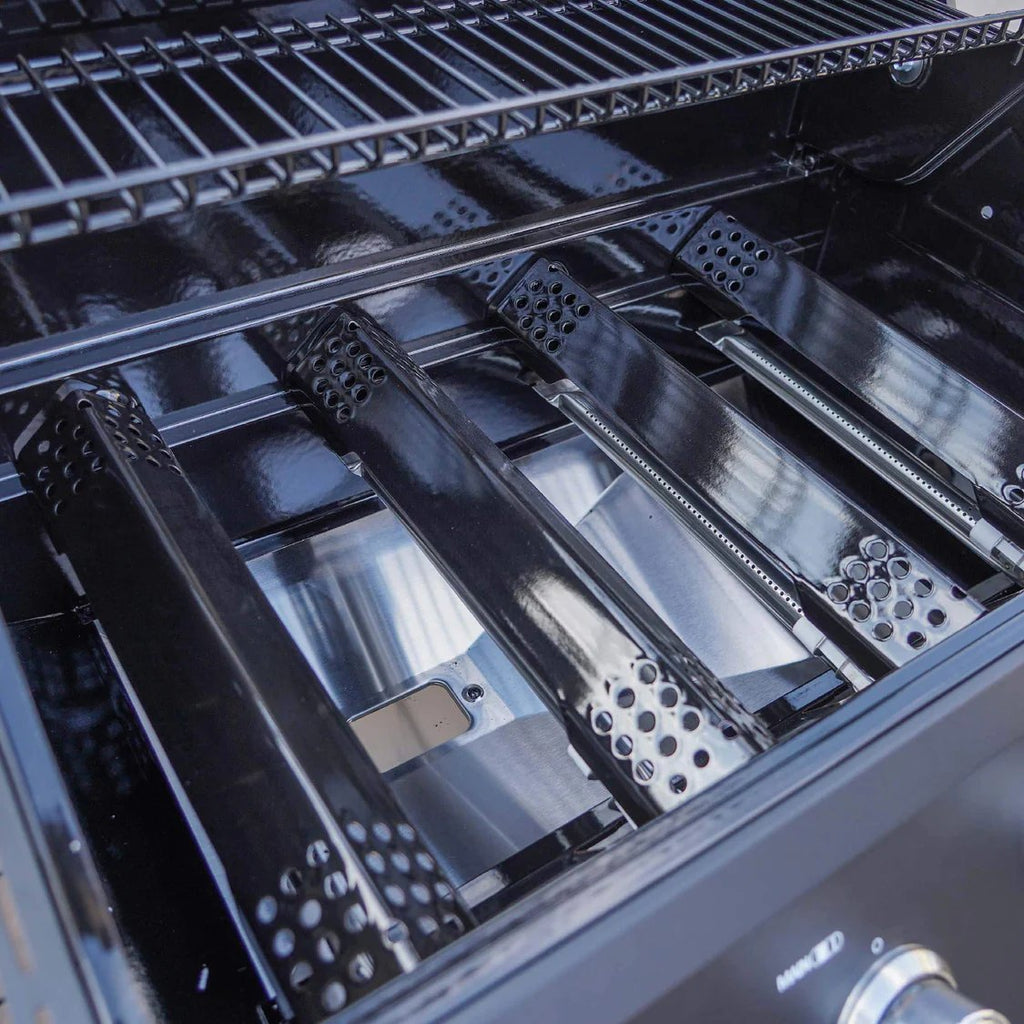 Close-up of a grill's interior with metal components and branding.