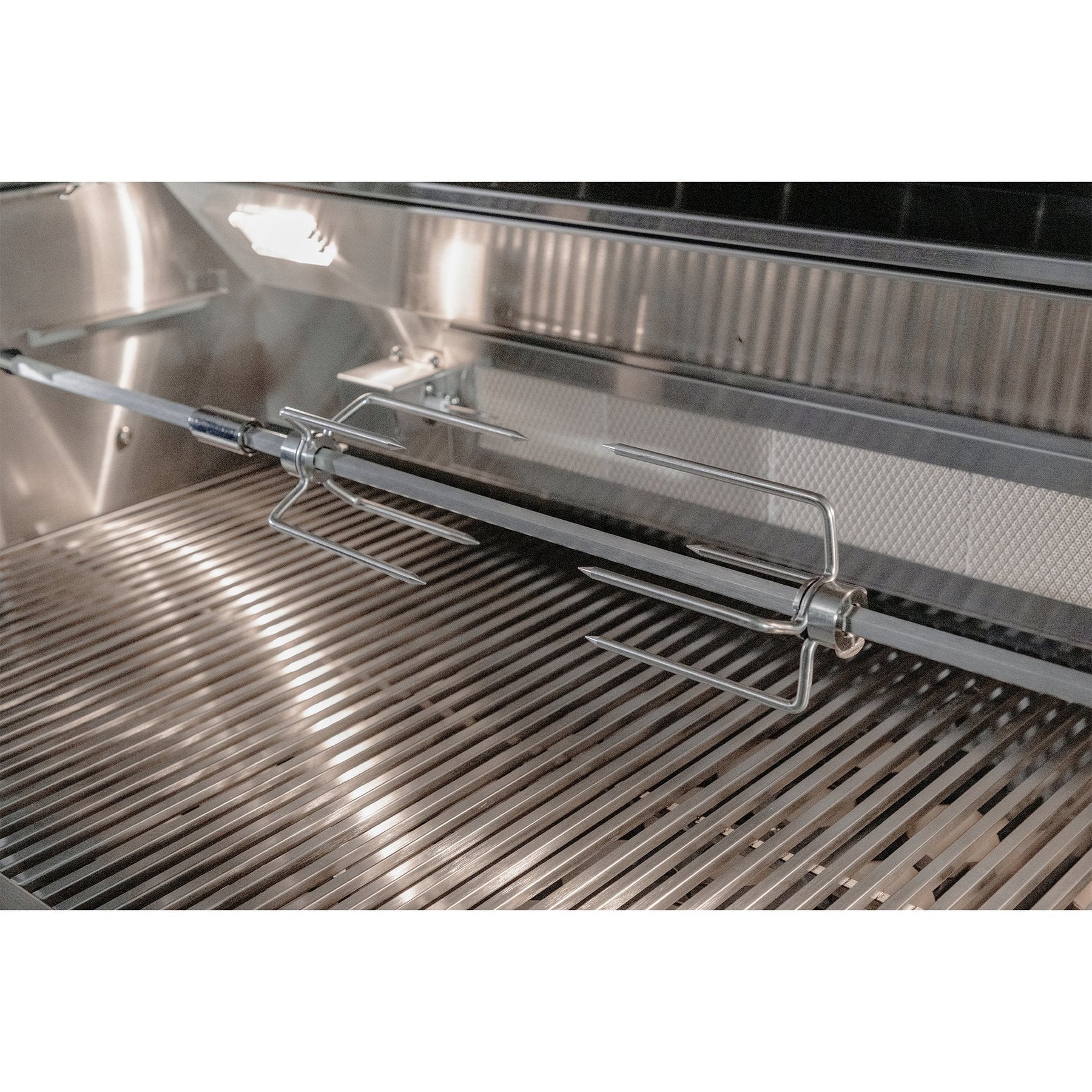 Stainless steel grill with a metal rack inside
