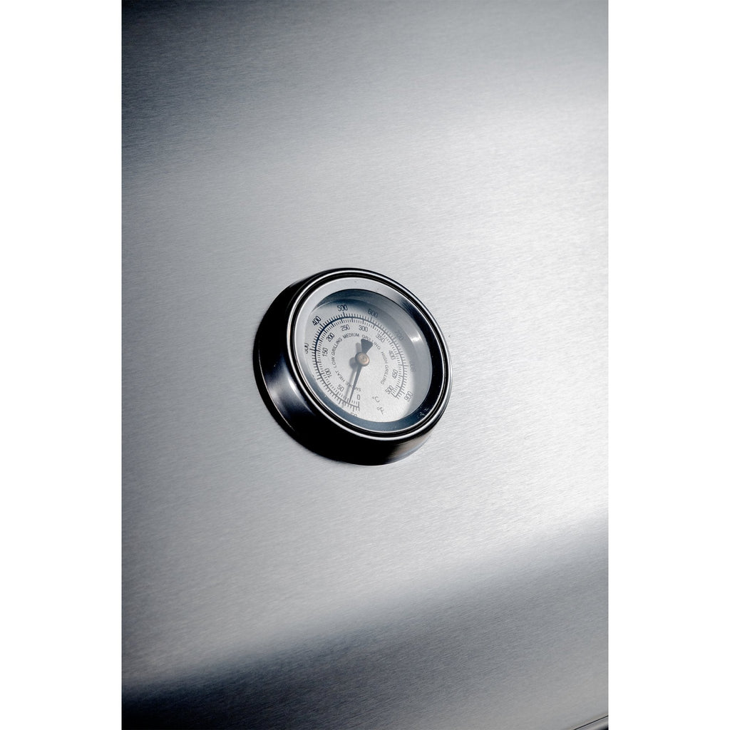 Stainless steel appliance with a round temperature gauge on a white background