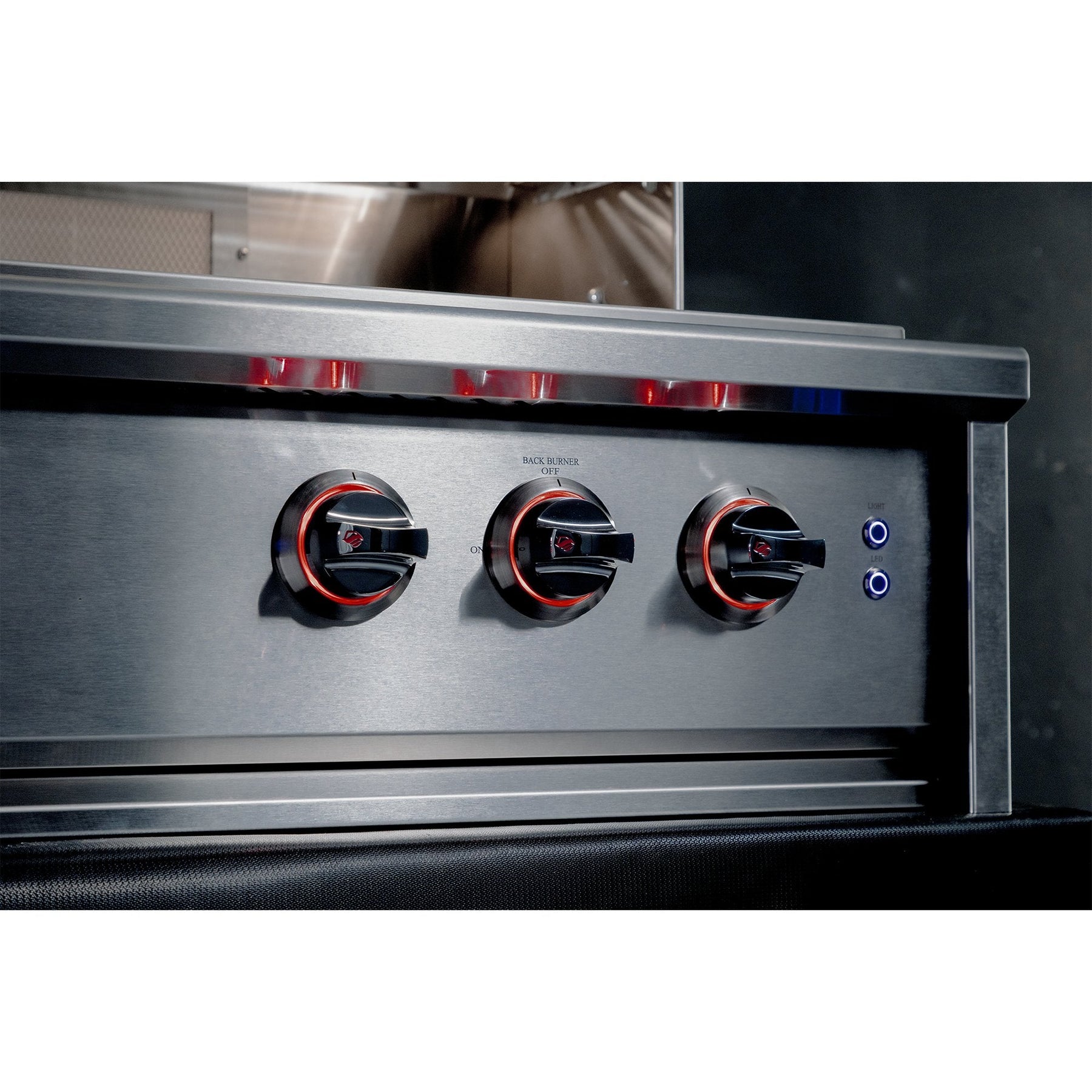 Stainless steel grill with three knobs and a control panel.