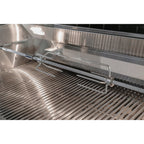 Stainless steel grill with a metal rack inside