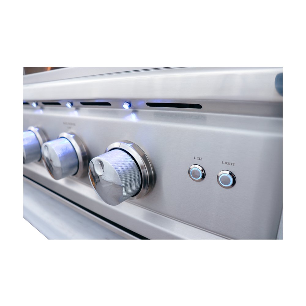 Close-up of a stainless steel appliance with control knobs and LED light indicator.