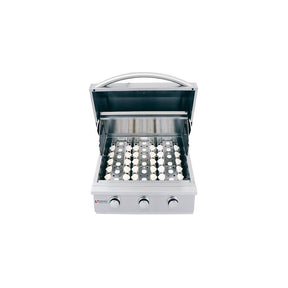 Stainless steel grill with multiple burners on a white background