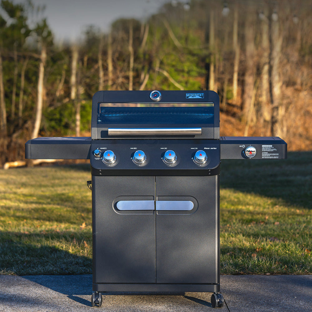Monument Grills Mesa 425 black propane gas grill with ClearView lid, 4 burners, side burner, and 630 sq in cooking area
