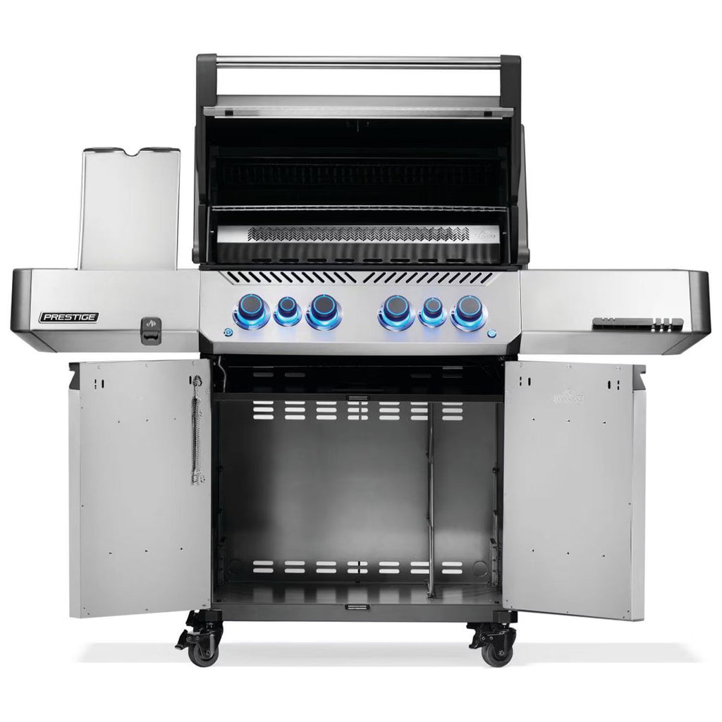Stainless steel gas grill with blue-lit knobs and open storage compartments