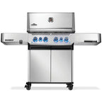 Stainless steel gas grill with blue knobs and side shelves for outdoor BBQ cooking